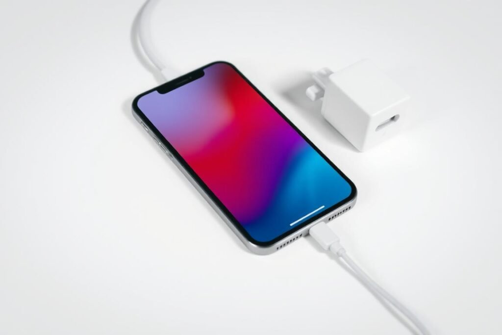 iPhone connected to lightning cable showing how to charge iPhone with cable iPhone connected to lightning cable showing how to charge iPhone with cable